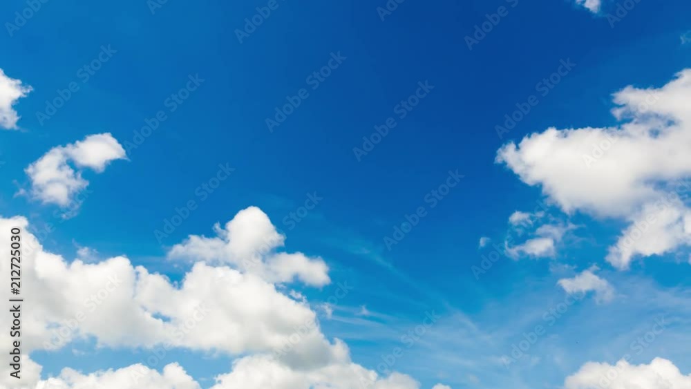 Time lapse clip of white fluffy clouds over blue sky Time lapse clip of white fluffy clouds over blue sky