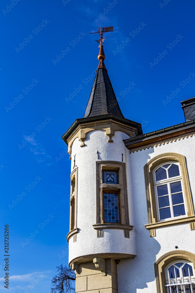 Architectural detail from Urspelt Castle in Urspelt, Grand Duchy of Luxembourg against a clear deep blue sky