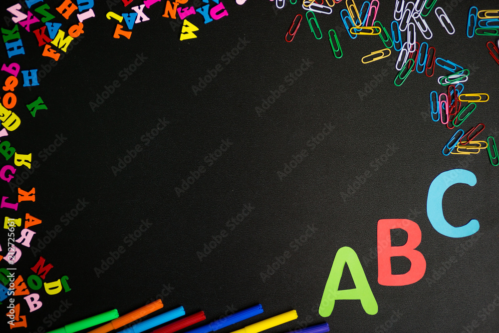 Back to school background. Top view of school supplies on chalkboard. Back to school background. Top view of school supplies on chalkboard.