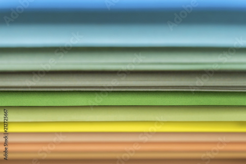 Colored sheets of paper side view rainbow concept