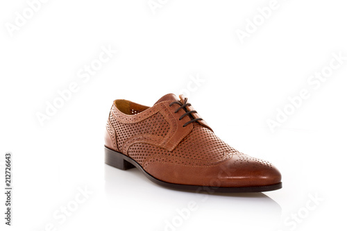 Close up of a brown mens derby shoes on white background with reflection. Fashion advertising shoes photos.