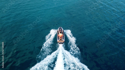 Aerial drone photo of Jet ski cruising in tropical waters photo