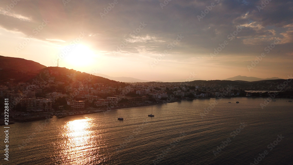 Aerial bird's eye photo taken with drone of famous rocky seascape in Porto Rafti bay at sunset, Mesogeia, Attica, Greece Aerial bird's eye photo taken with drone of famous rocky seascape in Porto Rafti bay at sunset, Mesogeia, Attica, Greece