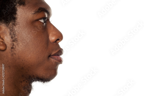 Profile of young black african american guy on white background