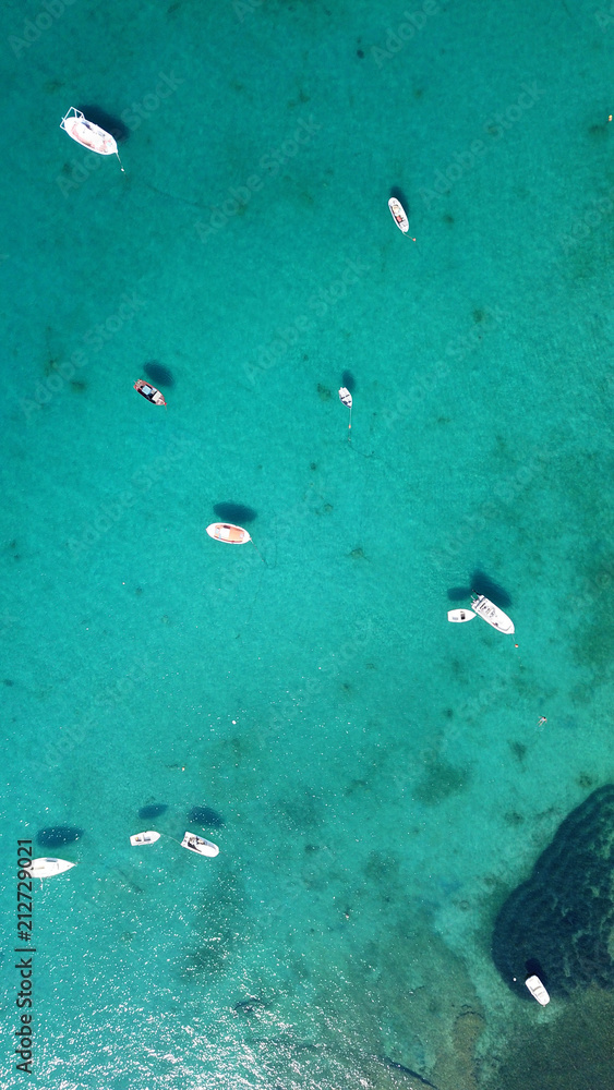 Aerial drone bird's eye view photo of traditional docked fishing boats in chora of island of Mykonos, Cyclades, Greece Aerial drone bird's eye view photo of traditional docked fishing boats in chora of island of Mykonos, Cyclades, Greece