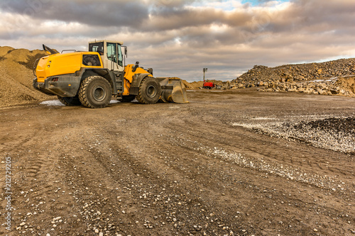 Excavator moving stone in an open pit mine in Spain