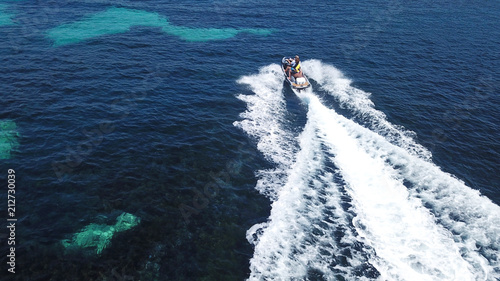 Top view of jet ski cruising in deep blue sea
