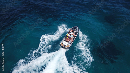 Top view of jet ski cruising in deep blue sea photo