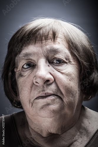 Studio portrait of elderly woman. Sad. Toned