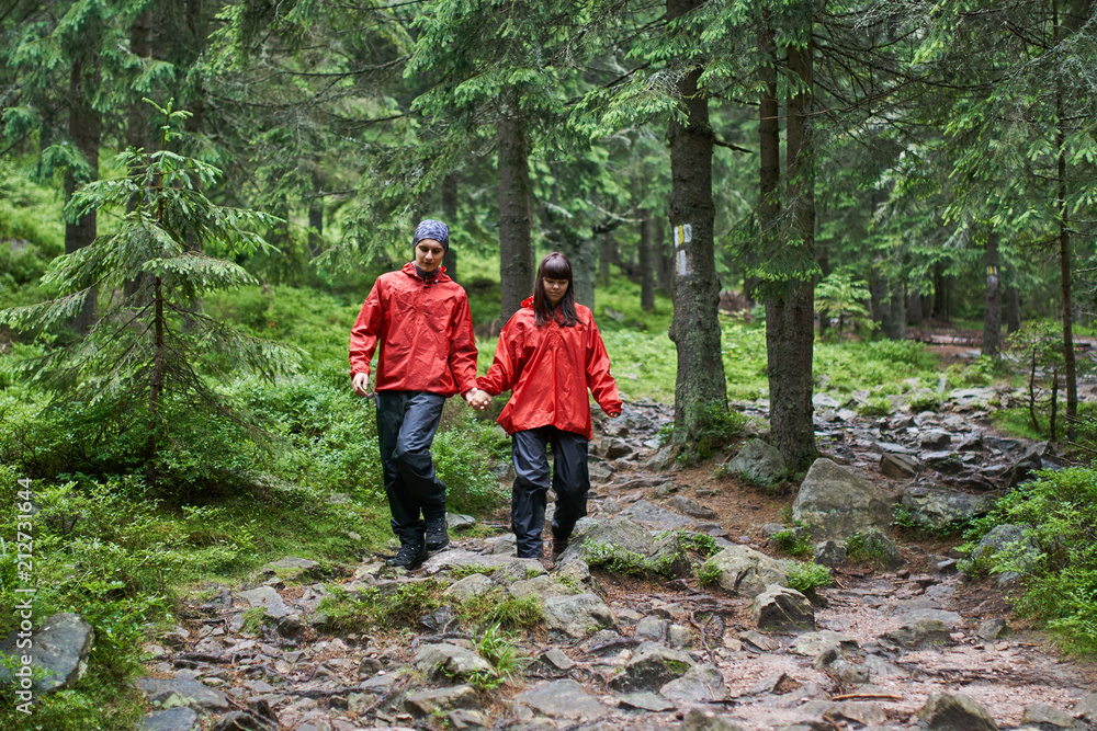 Young couple hiking in the highlands Young couple hiking in the highlands