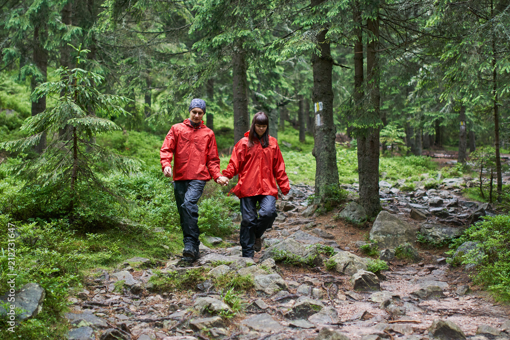 Young couple hiking in the highlands Young couple hiking in the highlands