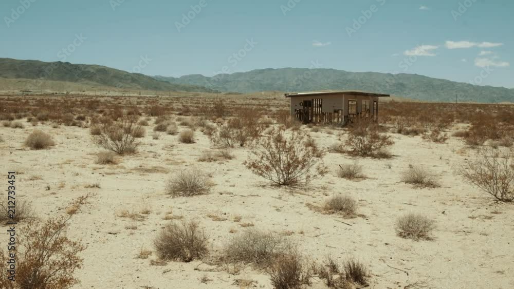 Old Abandoned building in Mojave desert - sunny hot day - Wide Slow panning Old Abandoned building in Mojave desert - sunny hot day - Wide Slow panning