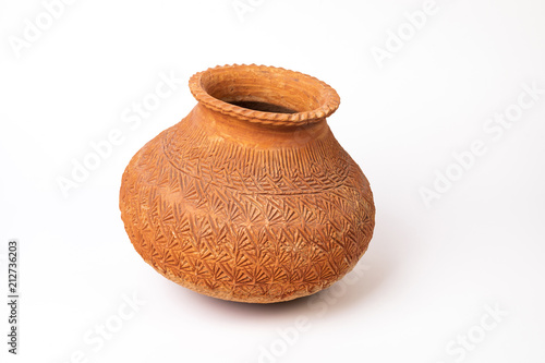 primitive clay pot on white background