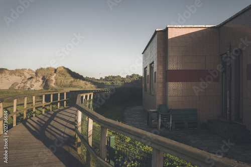 View empty wooden promenade at sunset, Salinas, Spain photo