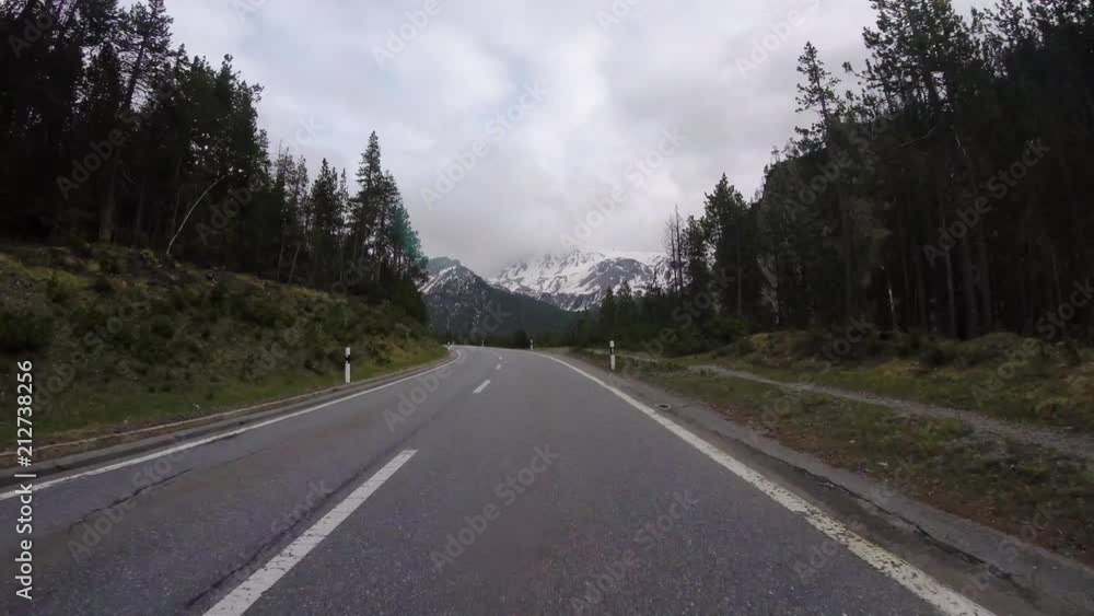 Driving on road in Switzerland National Park, first person view,pov perspective Driving on road in Switzerland National Park, first person view,pov perspective