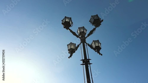 Classic Older Lamp and Blue Sky. Old Fashioned Street Light against a Blue Sky. Vintage style street lights by the day. Footage photo