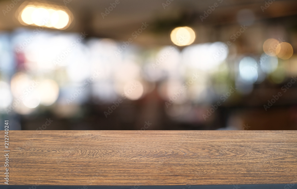 Empty dark wooden table in front of abstract blurred bokeh background of restaurant . can be used for display or montage your products.Mock up for space. Empty dark wooden table in front of abstract blurred bokeh background of restaurant . can be used for display or montage your products.Mock up for space.