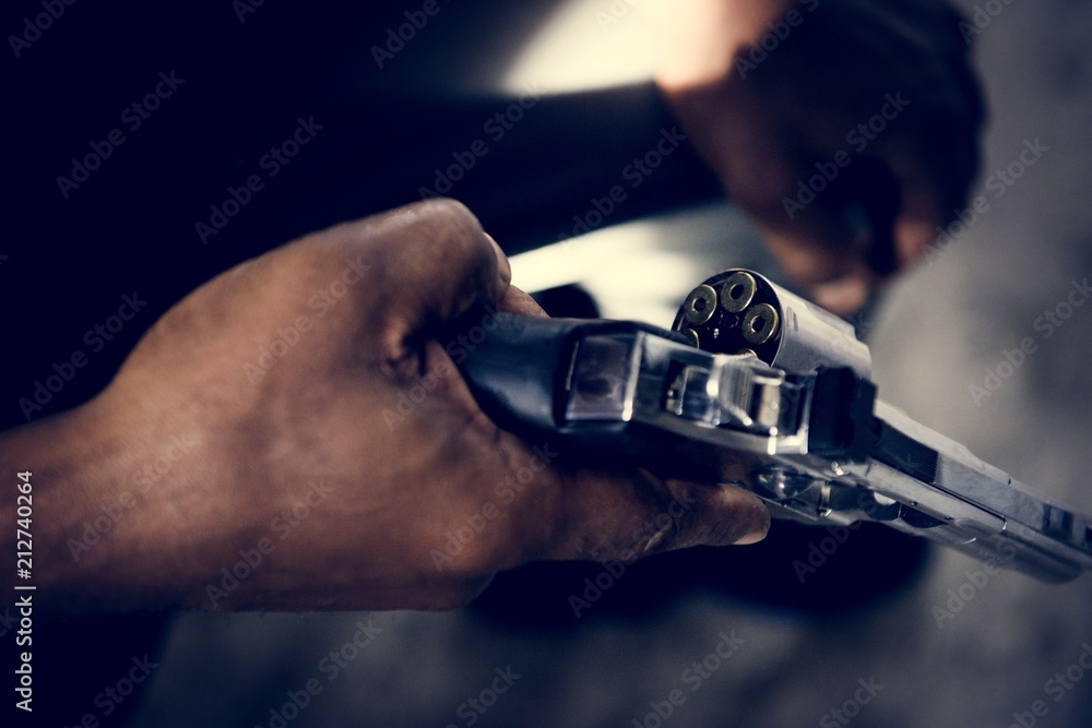 Photos Man holding a gun