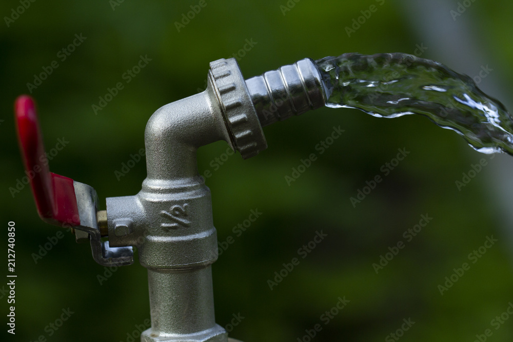 running water from the tap. lack of water for watering the garden. prohibiting watering the garden and swimming pools. outdoor water tap. half-conductor designed to connect the water hose