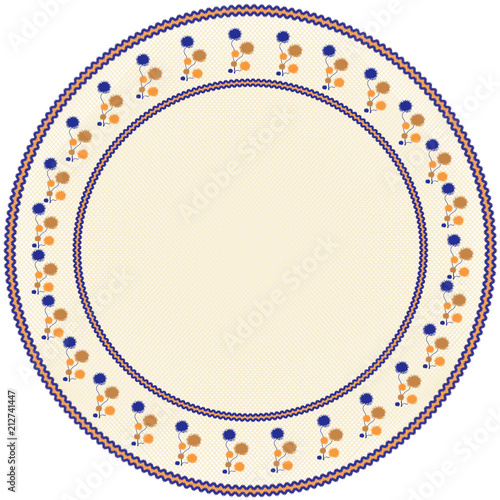 Round serviette with abstract floral  embroidery in blue brown,orange colors on weave beige backdrop with  fringe