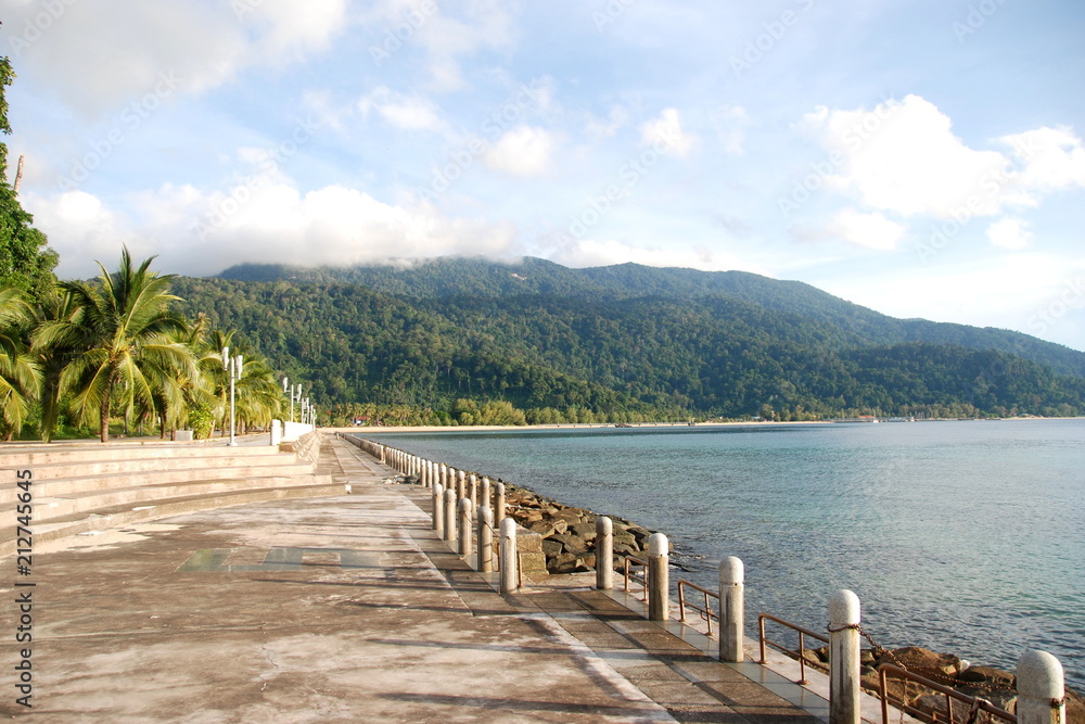 Fototapeta premium Walk along embankment of Tekek, the central village of Tioman island, Malaysia