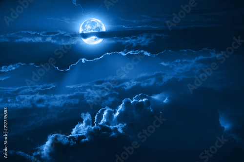 Romantic night sky with clouds, fool moon and moonlight