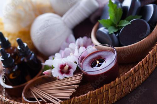 spa setting with hibiscus flowers on brown