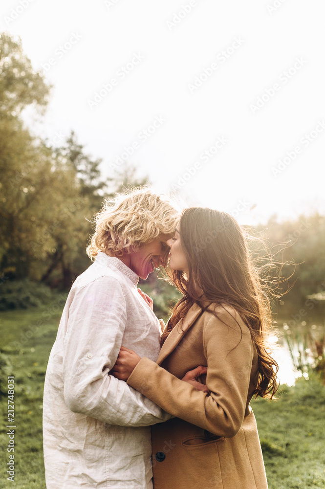 beautiful couple dressed in boho style walking in the sunny forest beautiful couple dressed in boho style walking in the sunny forest