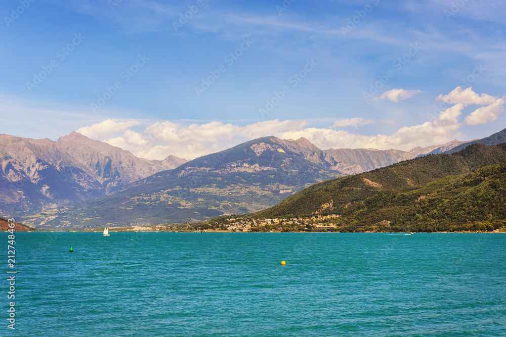 .The artificial lake Serre-Poncon in the French Alps. The lake water is used for irrigation of agricultural fields. It is a popular tourist destination. .The artificial lake Serre-Poncon in the French Alps. The lake water is used for irrigation of agricultural fields. It is a popular tourist destination.
