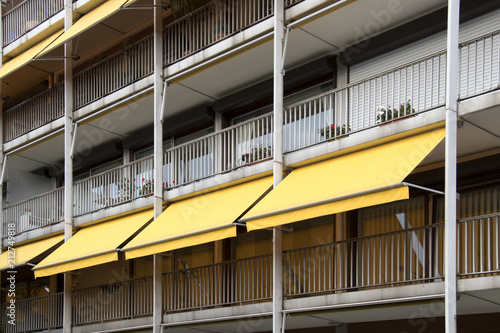 Balcony with yellow awning.