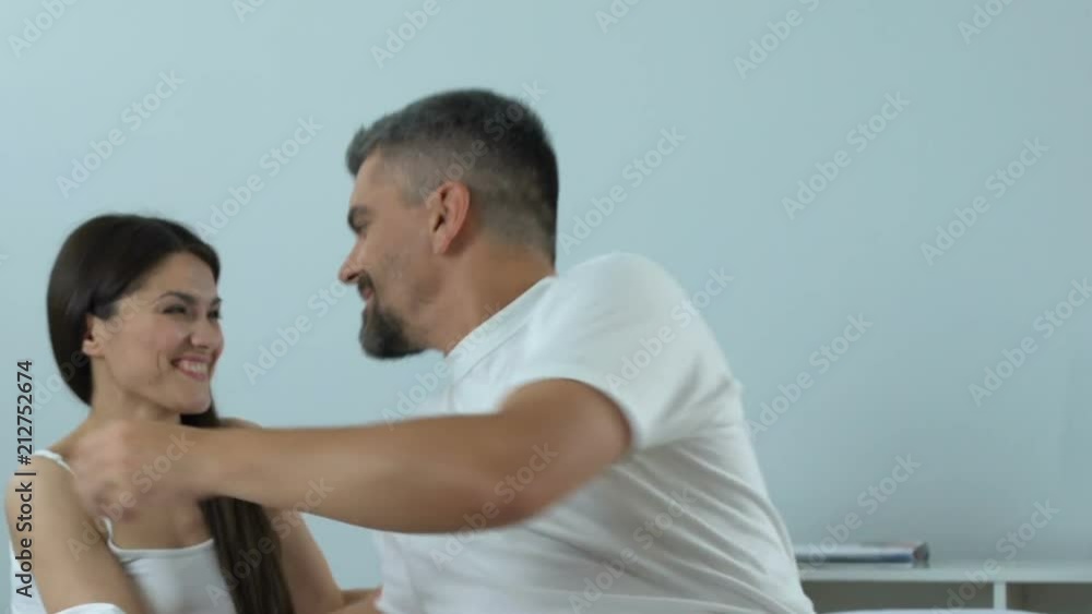 Man taking blue pill before making love with girlfriend, medicine, mens health Man taking blue pill before making love with girlfriend, medicine, mens health