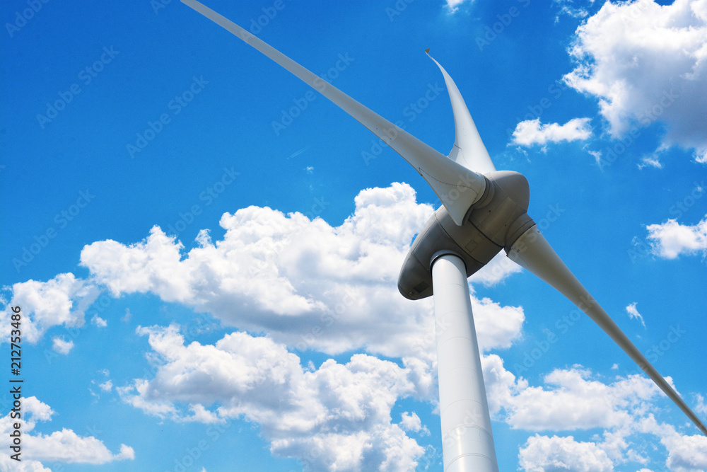 Looking up to a wind turbine generating electricity in a sunny day
Looking up to a wind turbine generating electricity in a sunny day
