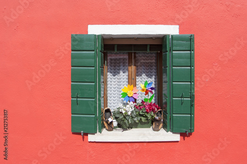 windwindow decoration at a small island of Burano in Venice,ow decoration at a small island of Burano in Venice, Italy photo