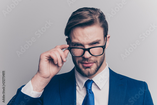 Suspicion proud respect distrust hesitate manipulate people person agent concept. Close up portrait of self-assured handsome confident recruiter touching glasses looking you isolated gray background