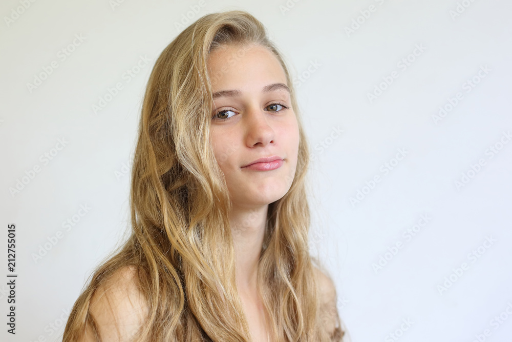 portrait of a teenage girl on a light background portrait of a teenage girl on a light background