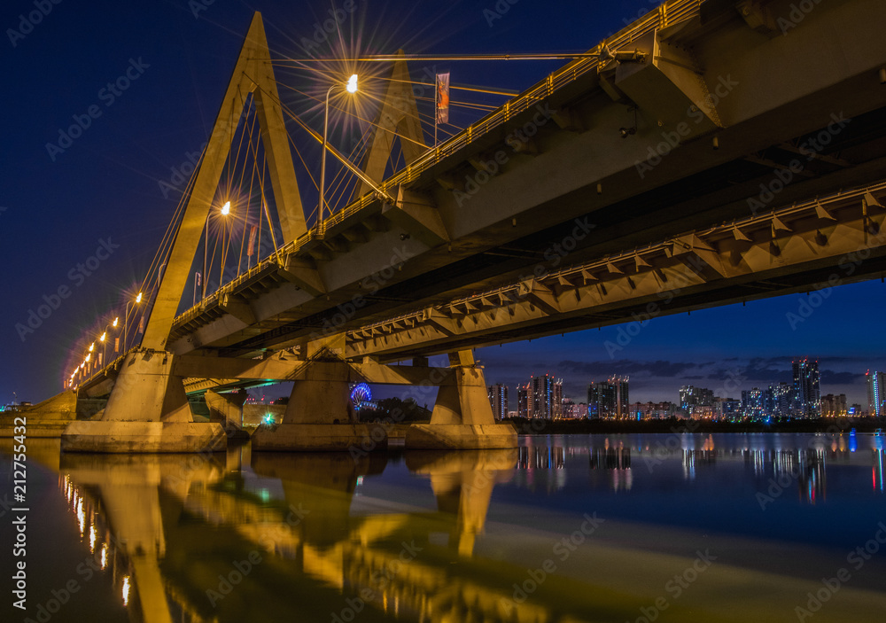 Millenium bridge in Kazan, reflected in the waters of the river Kazanka. Russia Millenium bridge in Kazan, reflected in the waters of the river Kazanka. Russia