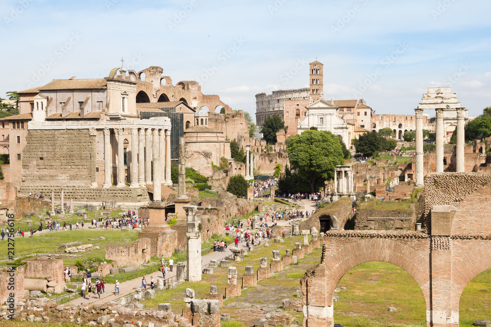 ROME, ITALY - MAY 3, 2015 : People walking in the Roman Forum. The place contains ancient government buildings at the center of Rome.