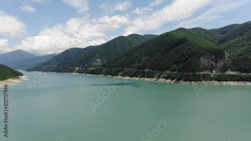 Wallpaper Mural Aerial photography of a blue lagoon surrounded by green hills, a beautiful clear sky. 4k Torontodigital.ca