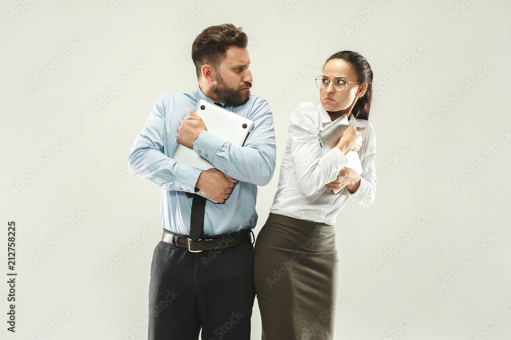 Angry boss. Woman and secretary standing at office or studio Angry boss. Woman and secretary standing at office or studio