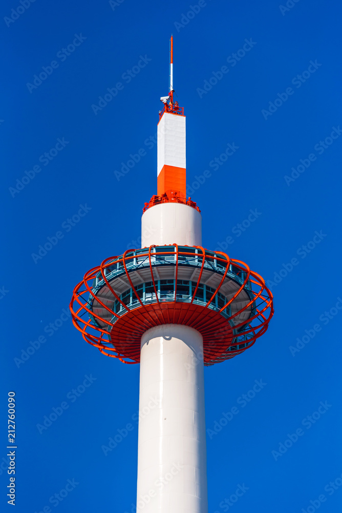 Kyoto Tower on blue sky background, Kyoto, Japan. Copy space for text. Vertical. Kyoto Tower on blue sky background, Kyoto, Japan. Copy space for text. Vertical.