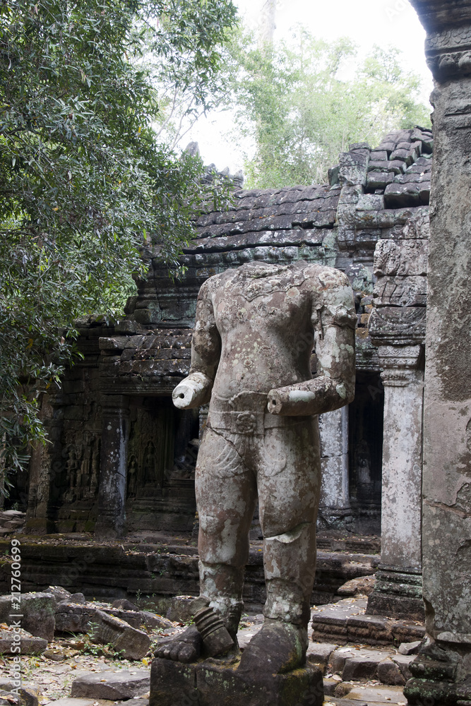 Angkor Cambodia, South Gate with headless guardian statue at entrance to the 12th century Preah Khan temple Angkor Cambodia, South Gate with headless guardian statue at entrance to the 12th century Preah Khan temple