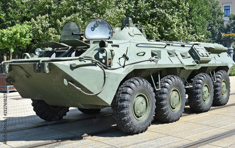 Fototapeta premium Armoured military vehicle on the street