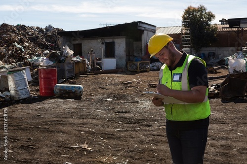 Worker writing on clipboard