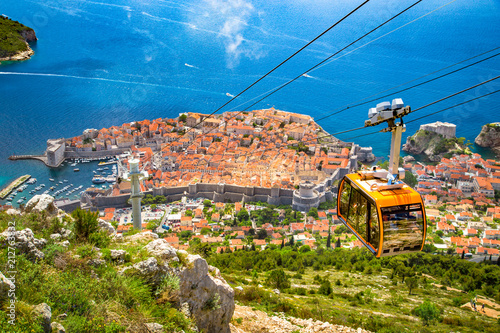 Old town of Dubrovnik with cable car ascending Srd mountain, Dalmatia, Croatia photo