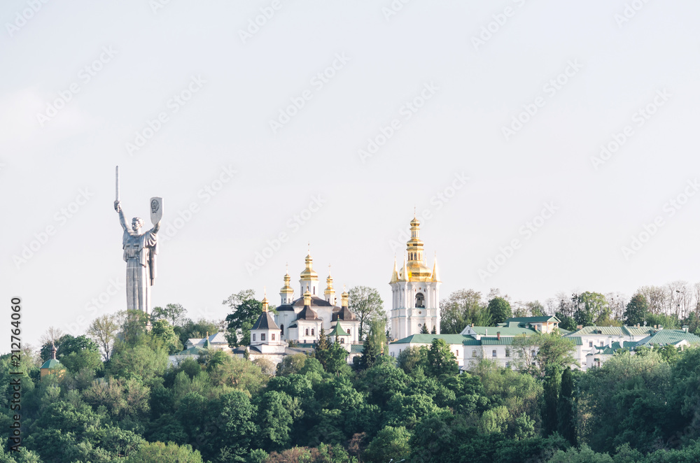 The Motherland Monument and Pechersk Lavra Cathedral, Kiev, Ukraine.
