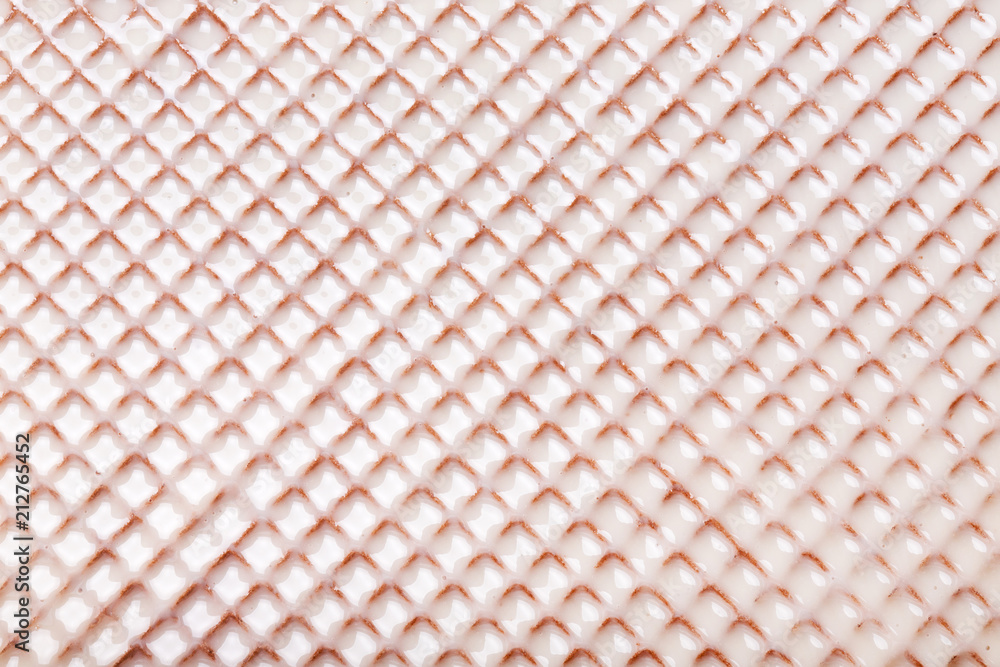 Fototapeta premium White hot chocolate on the wafer. Waffle covered with condensed milk close-up.