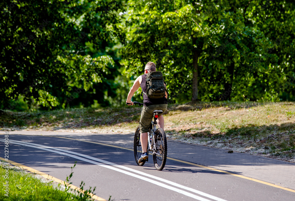     Cyclist ride on the bike path in the city Park 