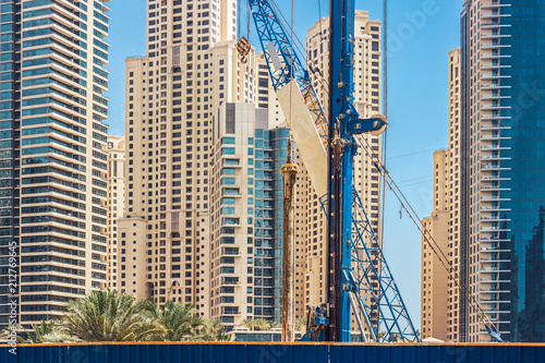 Construction in the center of the city among skyscrapers.