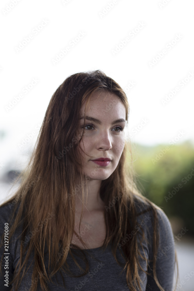 Portrait of a Pretty Woman Standing Outdoors Portrait of a Pretty Woman Standing Outdoors