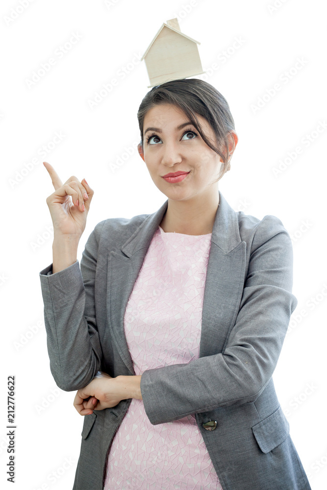 Beautiful young businesswoman put house model on head looking up and Finger pointing up . real estate loan concept isolated on white background with clipping path Beautiful young businesswoman put house model on head looking up and Finger pointing up . real estate loan concept isolated on white background with clipping path